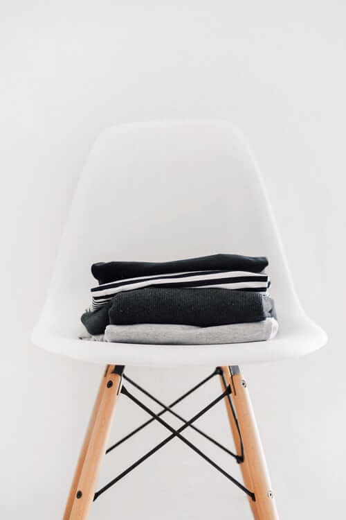Clothes Folded on Chair | The Mustcard