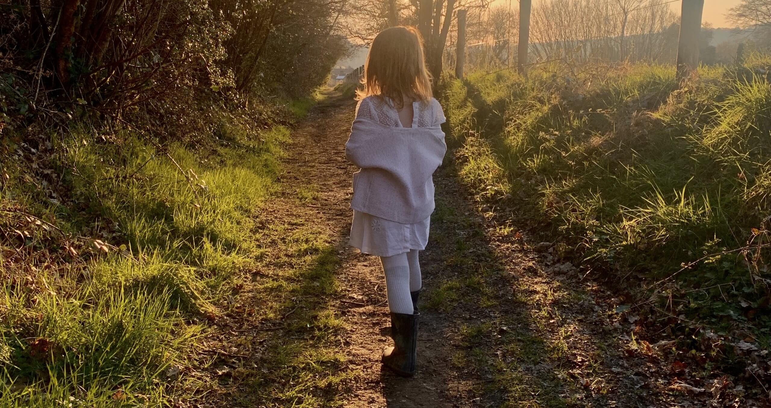 Child Walking in Field | The Mustcard